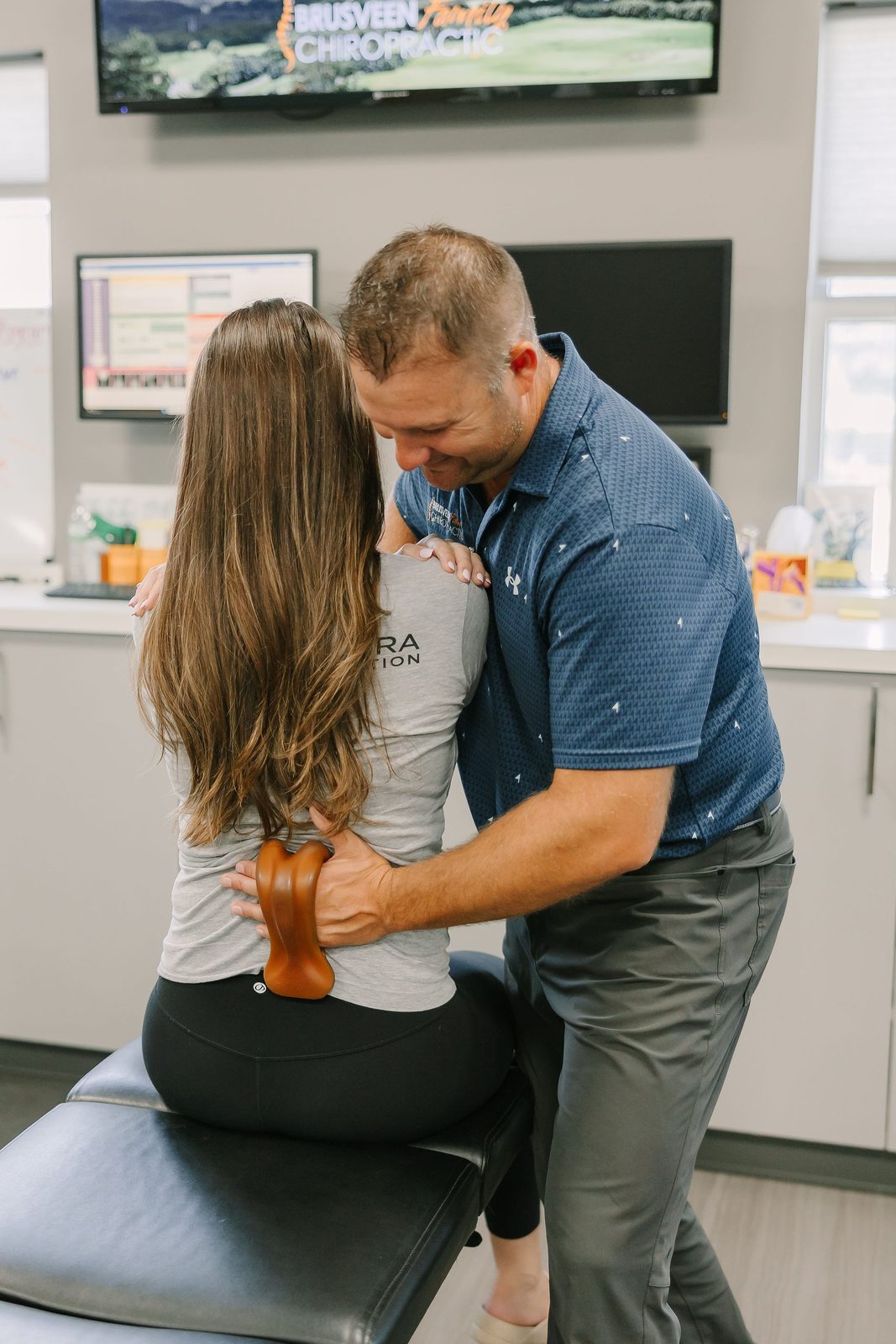 Chiropractor treating a patient for arthritis joint stiffness in Allendale, MI
